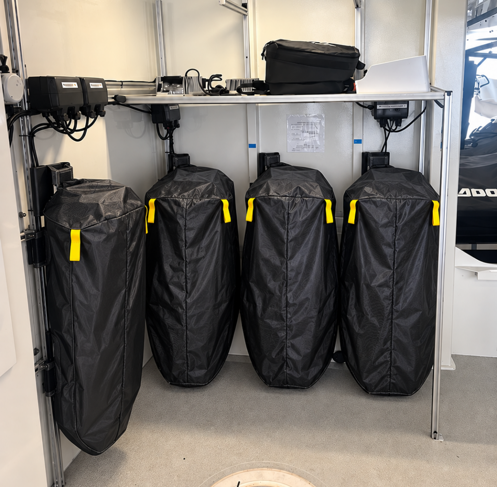 Fire Isolator lithium-ion fire containment blankets covering electric watercraft in a superyacht garage